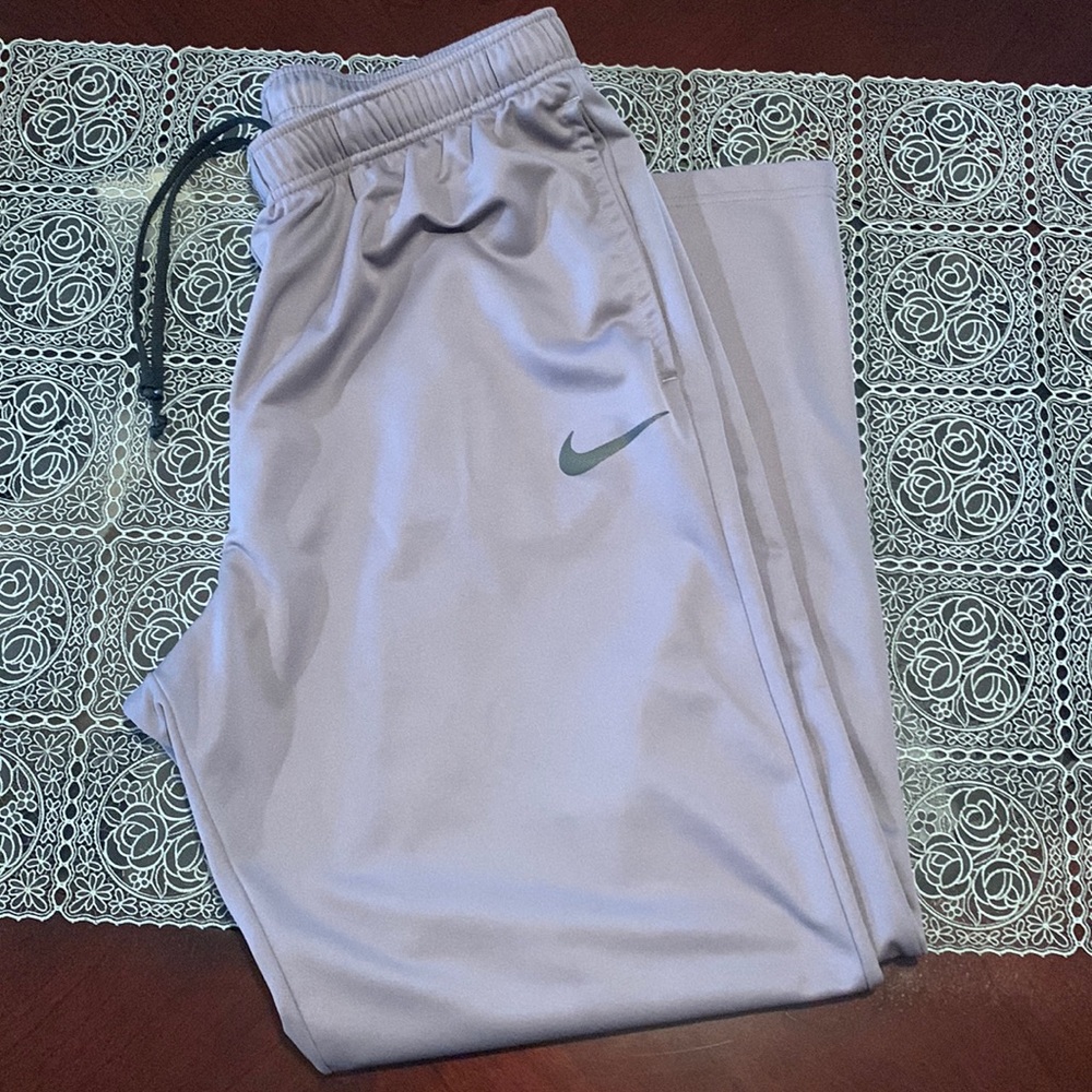 Grey Nike pants.